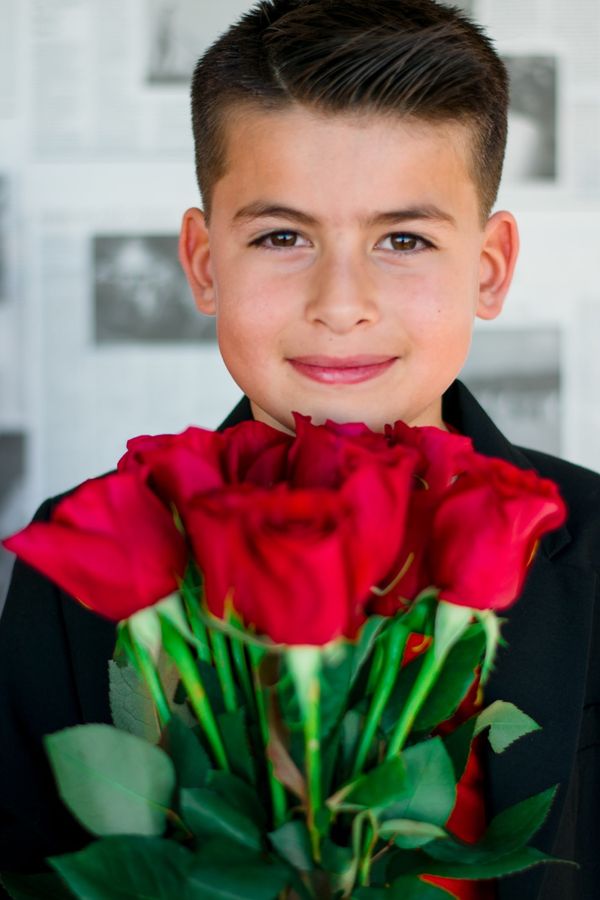 Young girl wearing heart-shaped sunglasses