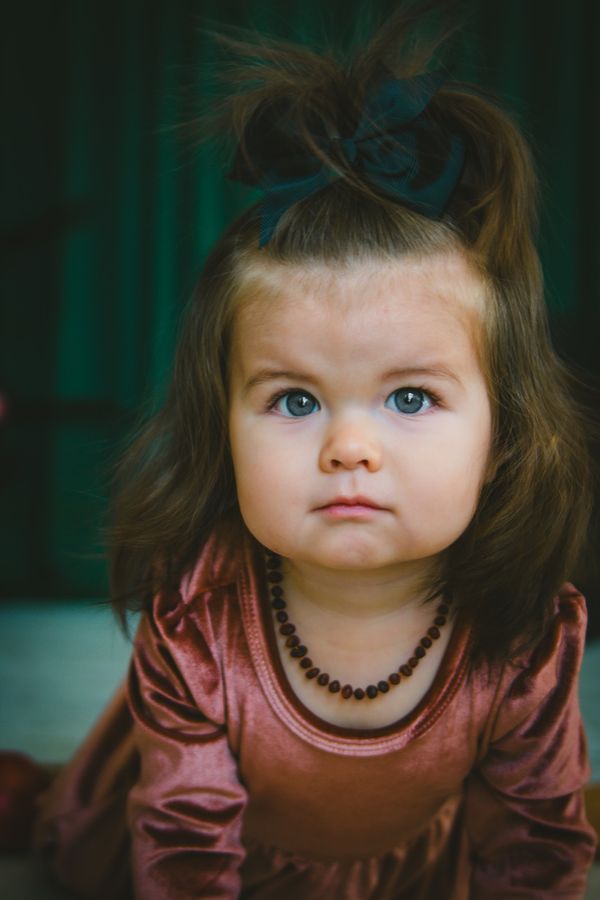 Baby portrait with a delicate bow