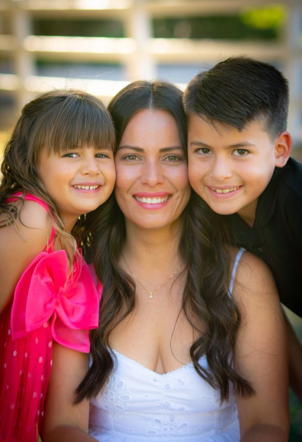 Family laughing together during portrait session