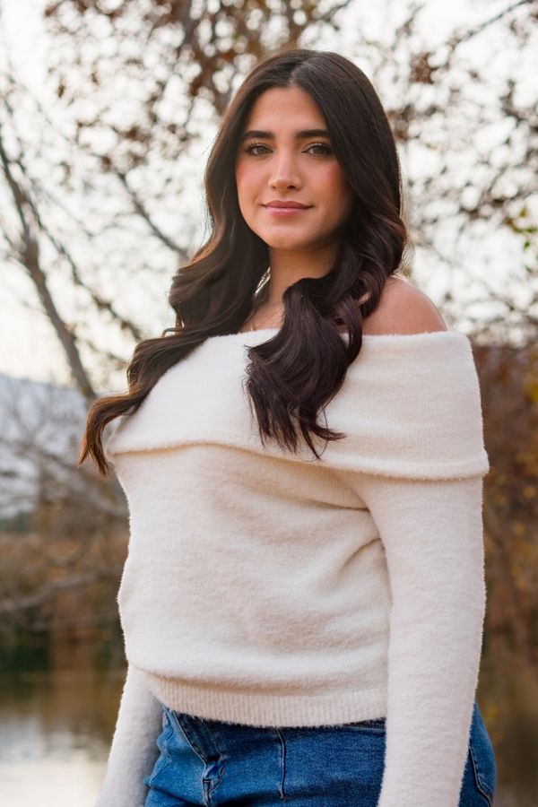 Young woman portrait in a cozy sweater