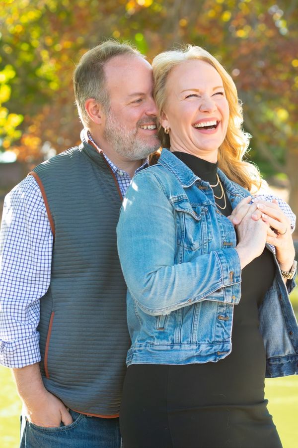 Couple laughing together outdoors