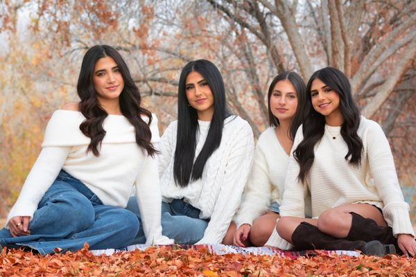 Four sisters posing together for a group portrait