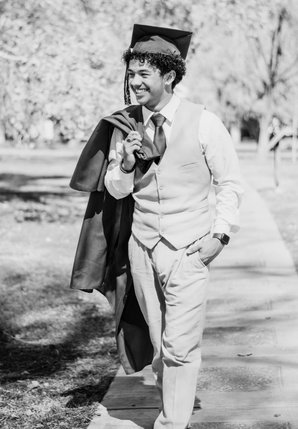 Graduate in a relaxed outdoor portrait