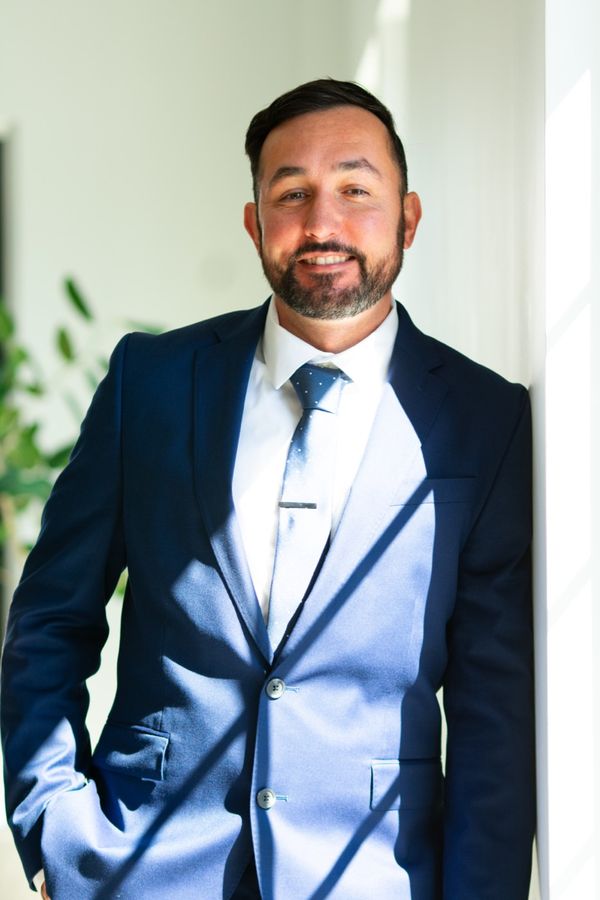 Man in a blue suit, standing portrait