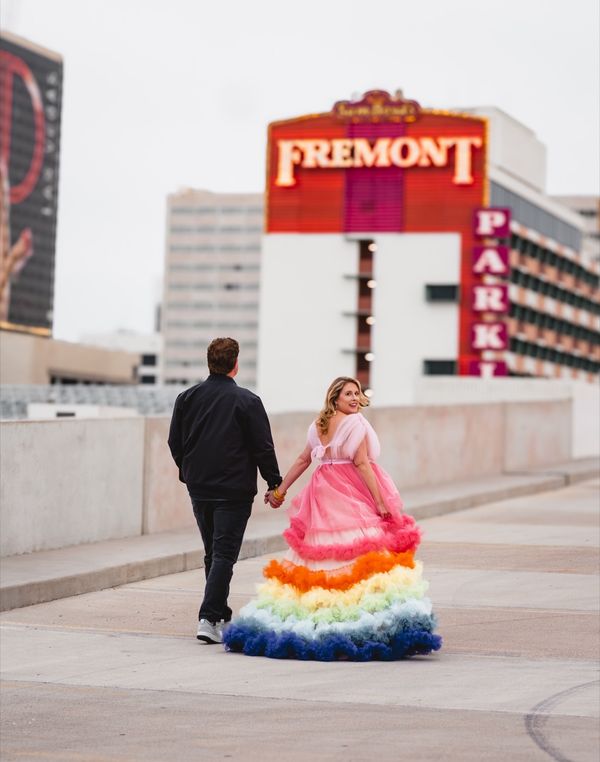 Couple posing at the Fremont Street sign